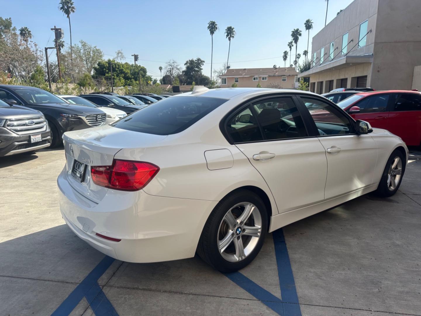 2012 WHITE /Tan BMW 3-Series Leather (WBA3C1C59CF) with an 4 Cylinder engine, Automatic transmission, located at 30 S. Berkeley Avenue, Pasadena, CA, 91107, (626) 248-7567, 34.145447, -118.109398 - Low Miles!! this 2012 BMW 3-Series 328i Sedan looks and drives well. Are you in search of a reliable and stylish vehicle in Pasadena, CA, but concerned about your credit history? Look no further! We have this impressive 2012 BMW 3-Series 328i Sedan with low miles available at our dealership. We unde - Photo#5